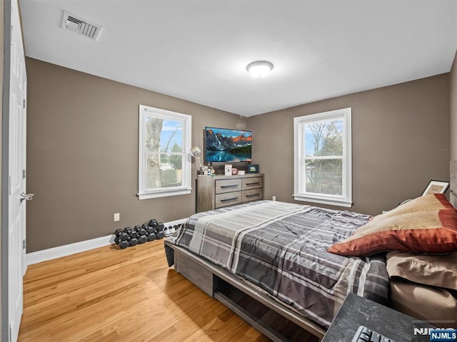 bedroom with light wood-type flooring