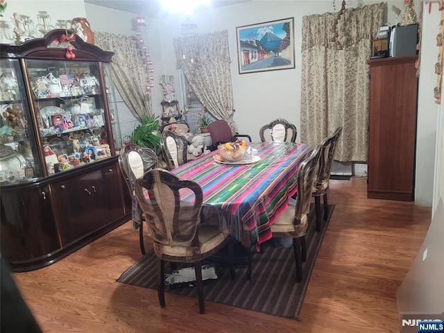 dining area featuring wood-type flooring