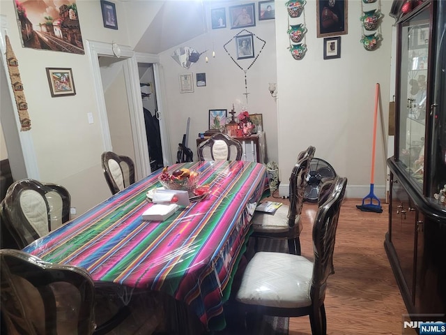 dining space with dark wood-type flooring