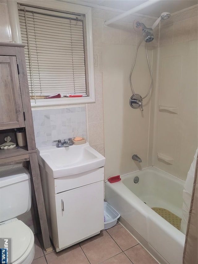 full bathroom with shower / bath combo, tile patterned flooring, tile walls, tasteful backsplash, and toilet