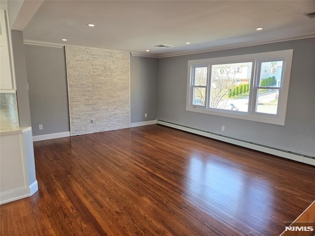 unfurnished room with dark hardwood / wood-style flooring, a baseboard heating unit, and ornamental molding