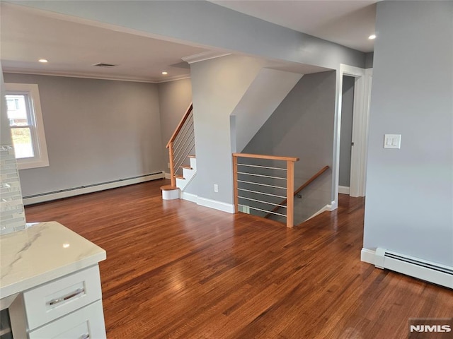 unfurnished living room with a baseboard radiator, ornamental molding, and dark hardwood / wood-style floors