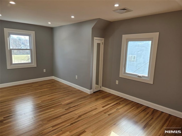 spare room featuring light wood-type flooring