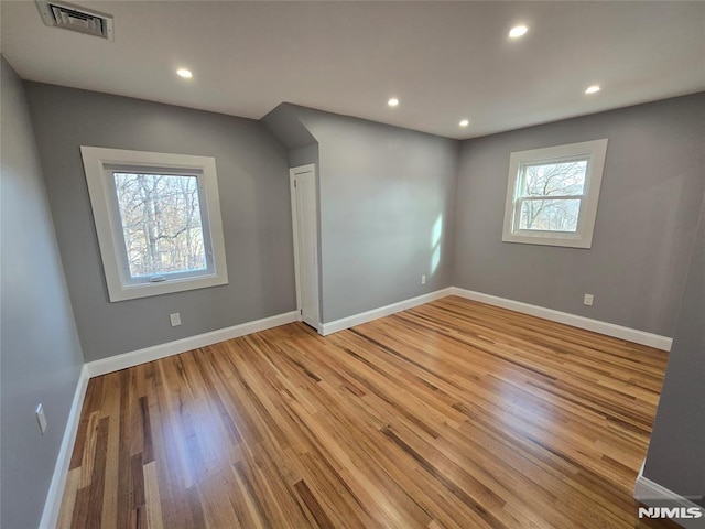 unfurnished room featuring light hardwood / wood-style flooring