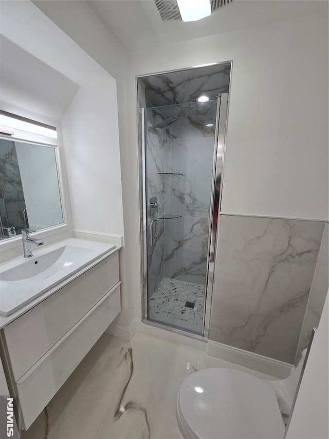 bathroom with vanity, toilet, and walk in shower