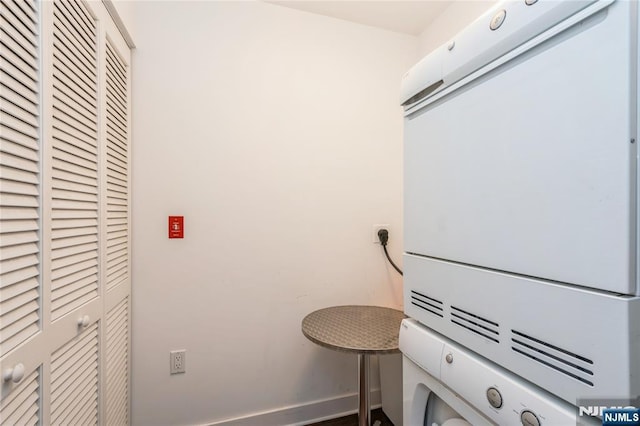 laundry room with stacked washer and dryer