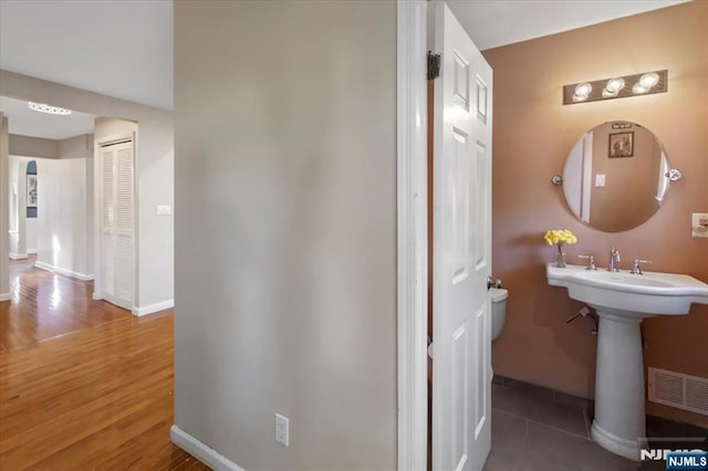 bathroom featuring hardwood / wood-style flooring