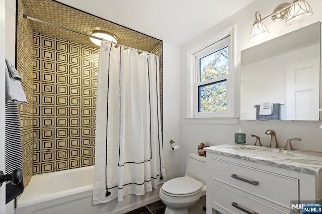 full bathroom with vanity, toilet, and shower / bath combo