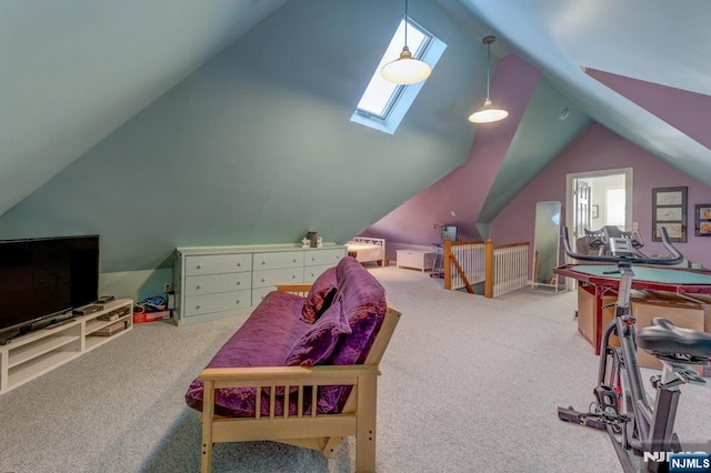 recreation room with carpet floors and vaulted ceiling with skylight