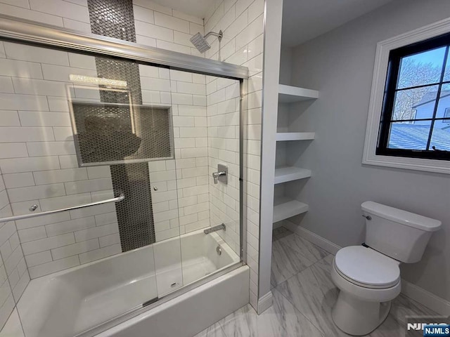 bathroom with bath / shower combo with glass door, built in features, and toilet