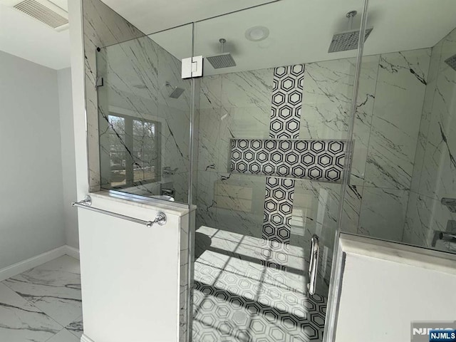 bathroom with tiled shower