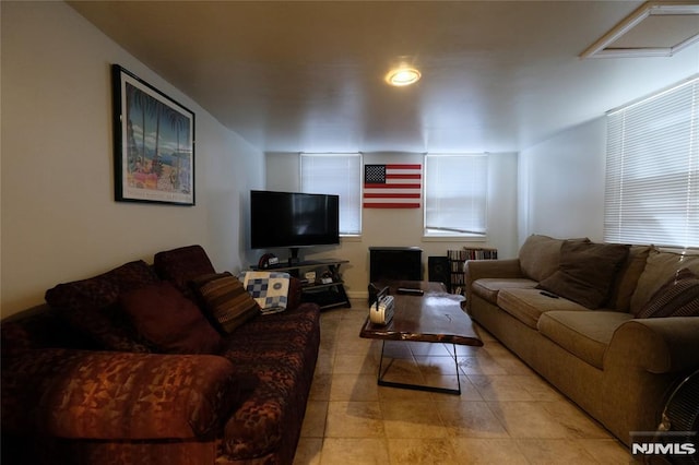 living room with light tile patterned floors