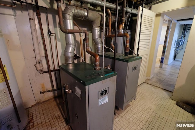 utility room featuring water heater