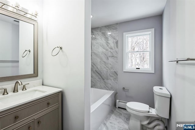 full bathroom featuring baseboard heating, vanity, toilet, and tiled shower / bath combo