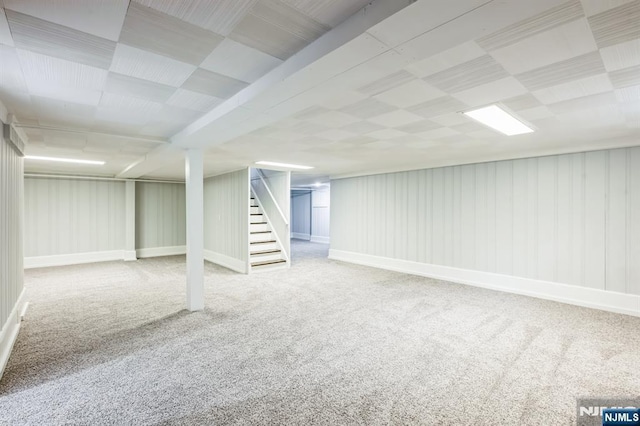 basement featuring carpet flooring