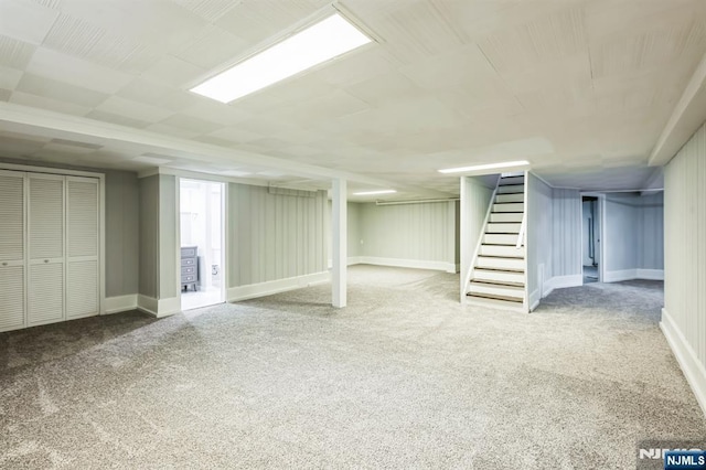 basement featuring carpet flooring