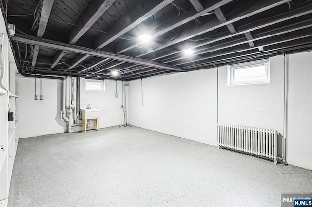 basement with radiator and sink