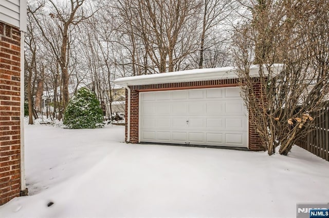 view of snow covered garage