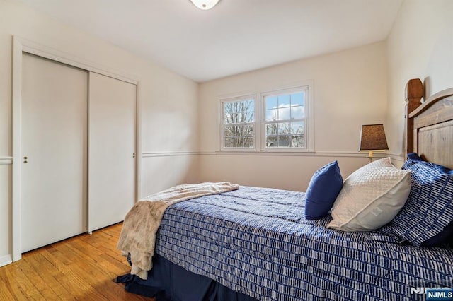 bedroom featuring a closet and wood finished floors