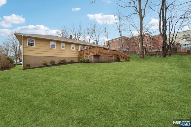 view of yard featuring stairs and a deck