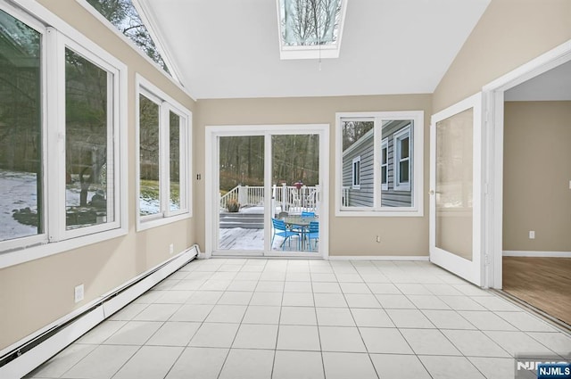 unfurnished sunroom with a baseboard radiator and vaulted ceiling with skylight