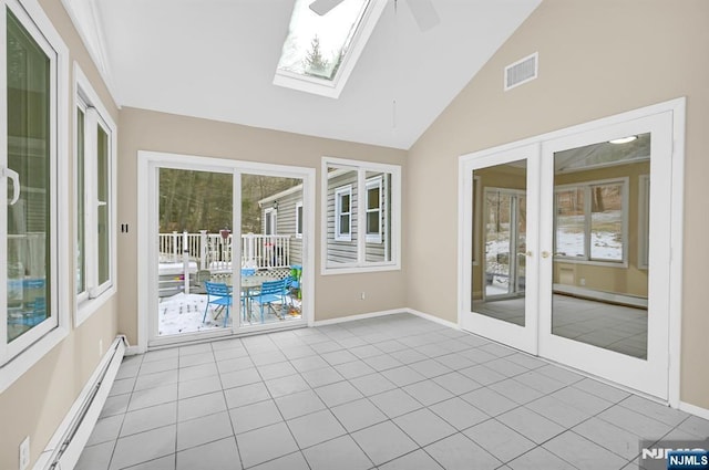 unfurnished sunroom featuring lofted ceiling with skylight, a baseboard heating unit, ceiling fan, and french doors