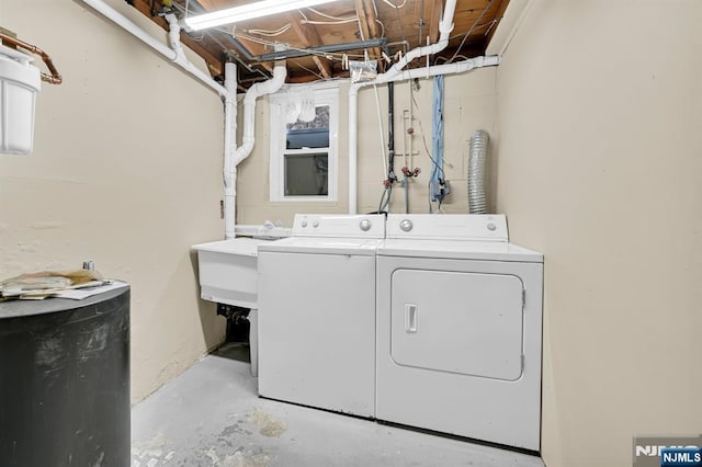 laundry room with independent washer and dryer