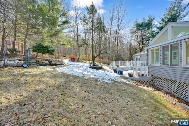 view of yard with a deck