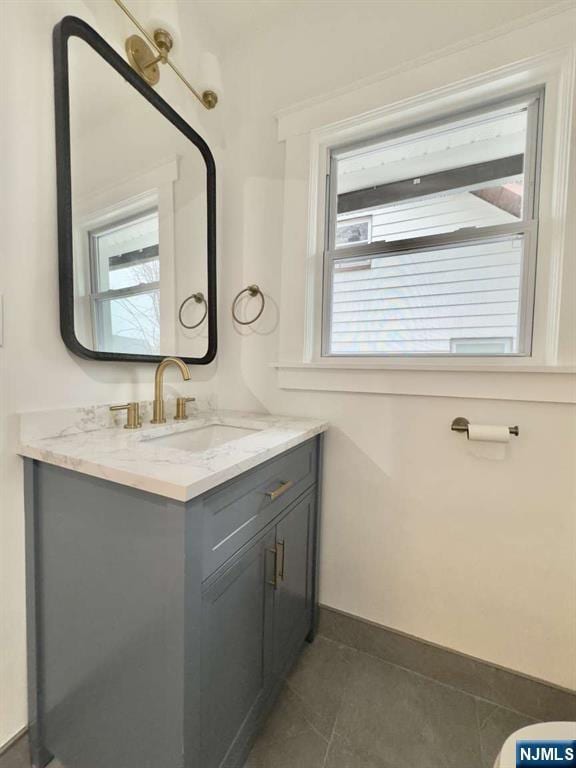 bathroom with vanity and tile patterned floors