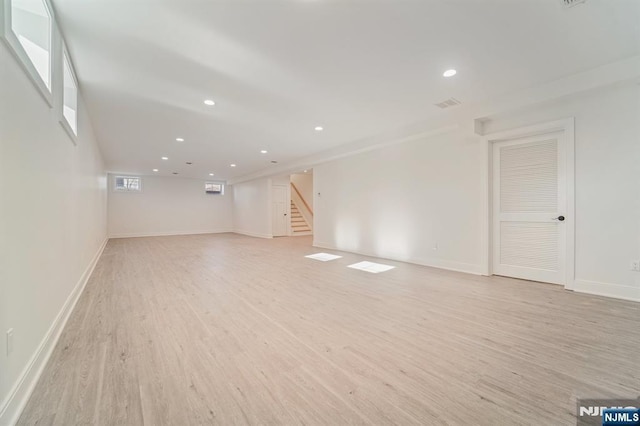 unfurnished living room with light hardwood / wood-style flooring