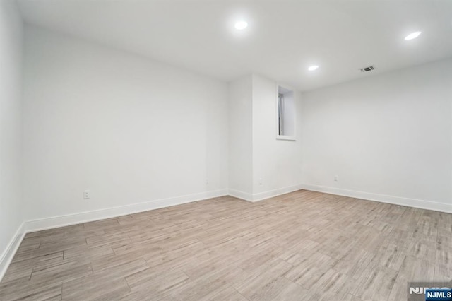 spare room with light wood-type flooring