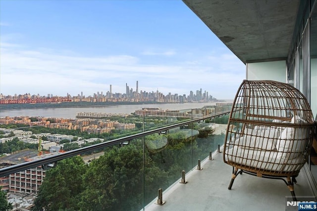 balcony featuring a water view