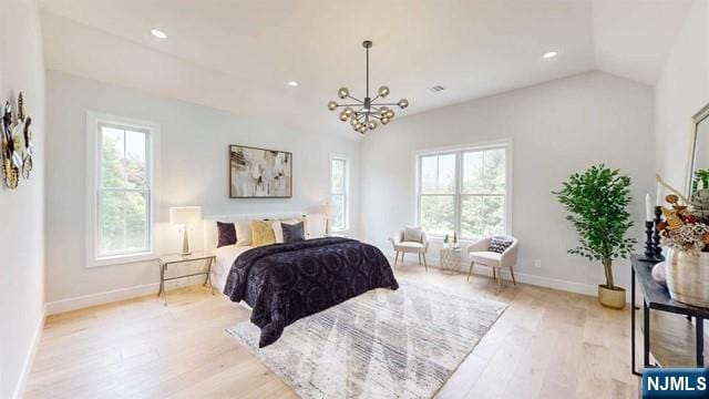 bedroom featuring recessed lighting, multiple windows, vaulted ceiling, and light wood finished floors