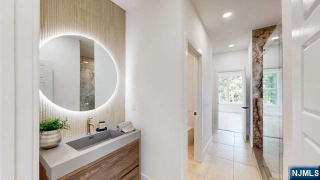 bathroom with recessed lighting, vanity, and tile patterned floors