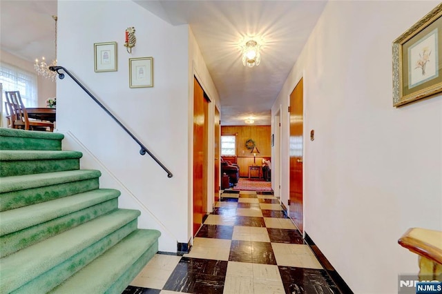 interior space featuring a healthy amount of sunlight, a notable chandelier, and tile patterned floors