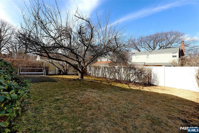 view of yard with a fenced backyard