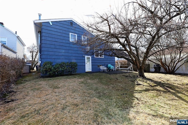 view of home's exterior featuring a yard