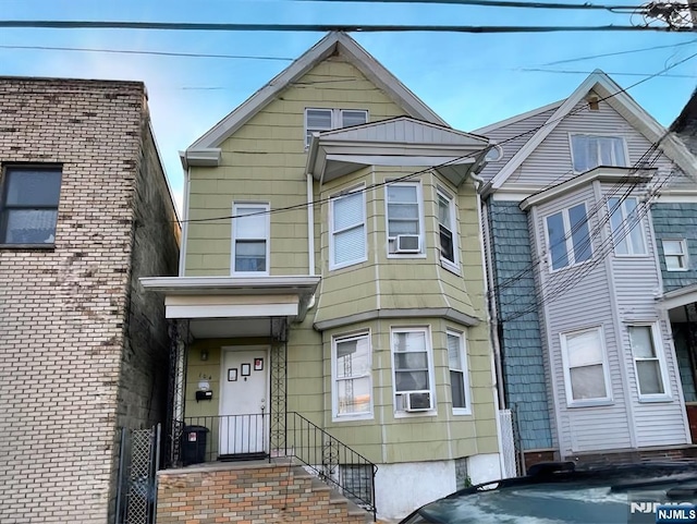 view of front of property with cooling unit