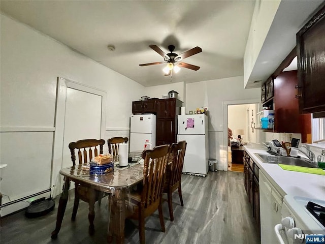 dining room with light hardwood / wood-style flooring, sink, a baseboard radiator, and ceiling fan