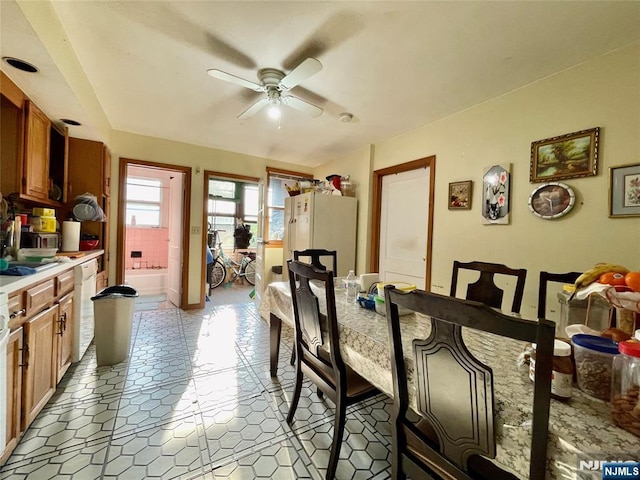 dining space with ceiling fan and light tile patterned floors