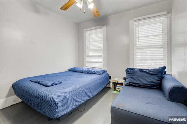 bedroom featuring hardwood / wood-style floors and ceiling fan