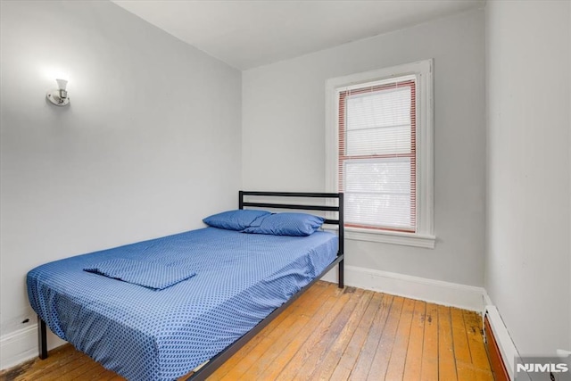 bedroom with hardwood / wood-style flooring