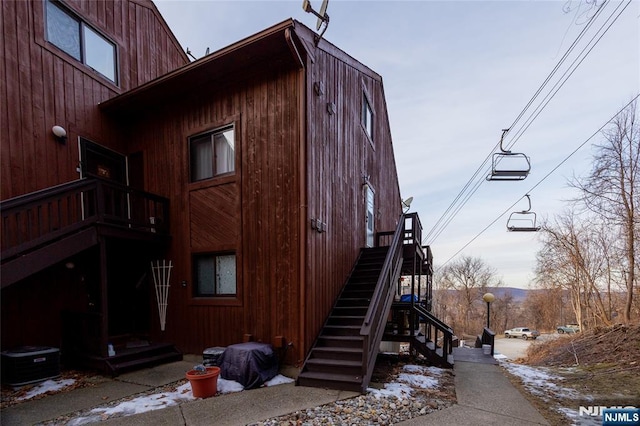 view of snow covered exterior with central air condition unit