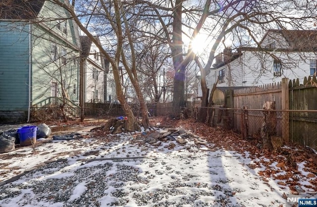 view of yard layered in snow