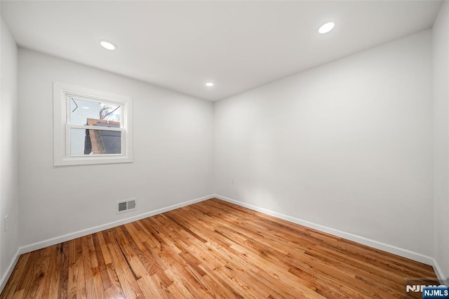 empty room featuring wood-type flooring