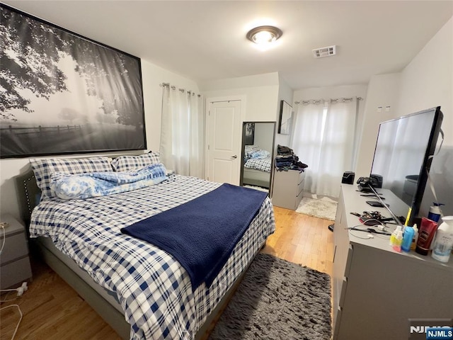 bedroom featuring hardwood / wood-style flooring