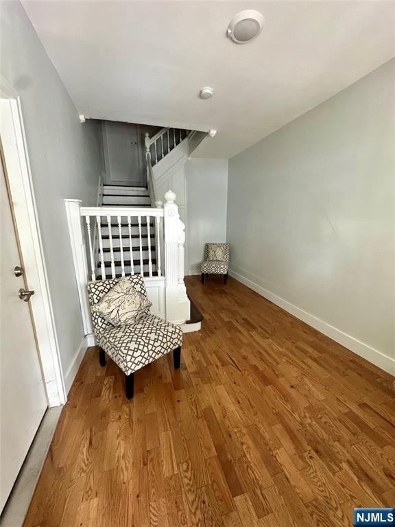 sitting room featuring hardwood / wood-style floors