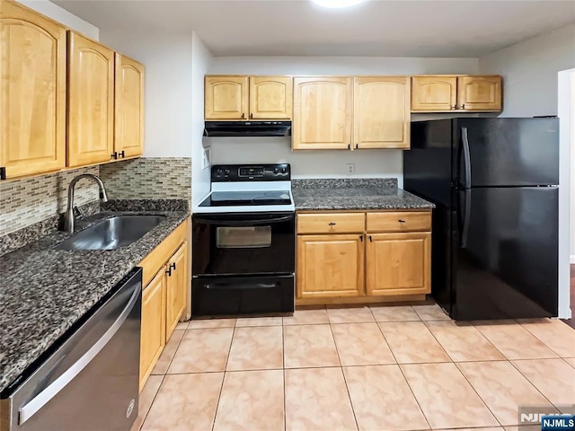 kitchen featuring dark stone countertops, sink, light brown cabinets, and black appliances