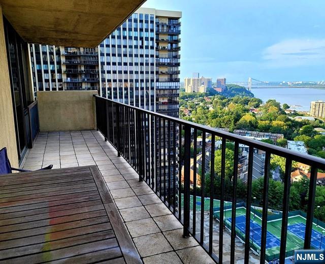 balcony featuring a water view