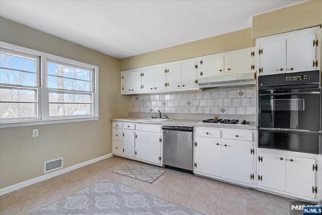 kitchen with white gas cooktop, dishwasher, sink, and white cabinets